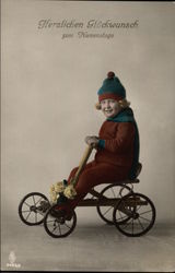 Child in Winter Clothes on a Bike Postcard