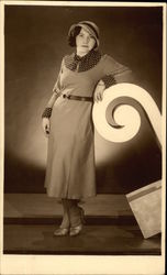 A Woman modeling a Dress and Hat Postcard