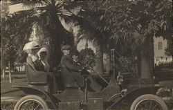 Two Men & Two Women in Model T Automobile Postcard