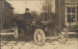 Man Sitting in Old-Fashioned Car Postcard