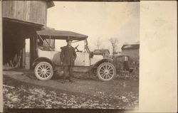 Man Standing in Front of Model T Ford Postcard
