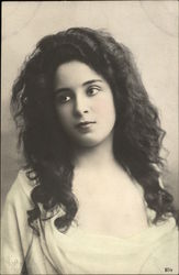 Photograph of Young Raven-haired Woman in Low Cut Dress Postcard