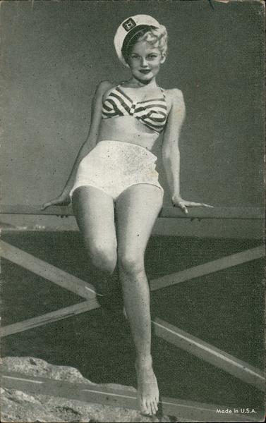 Woman in Sailors Hat, Striped Top and White Shorts