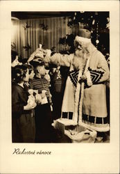 Santa Claus Handing Out Gifts to Children Postcard