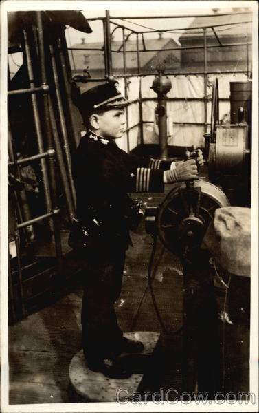 Boy in Uniform at Helm of Baot Boys