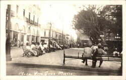 Men Sitting on Benches in the Plaza Postcard