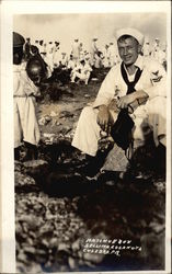 Native boy selling coconuts to sailor Postcard