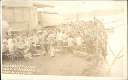 USS Texas - Sailors Enjoying a Hearty Meal Topside Postcard