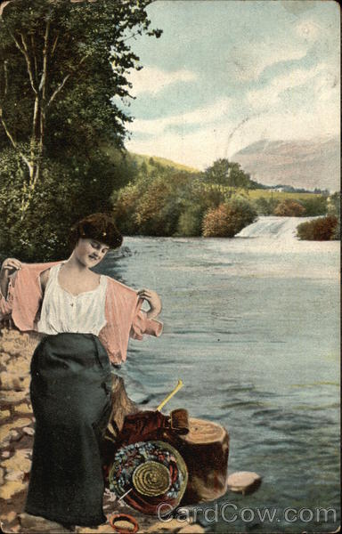 Woman in pink sweater at waterside, bathing Women