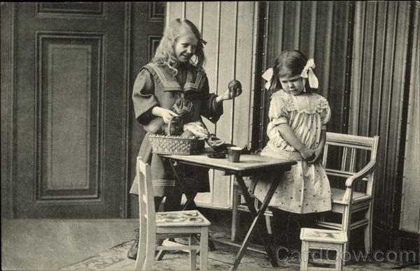 Girl offering another girl an apple Norway Girls