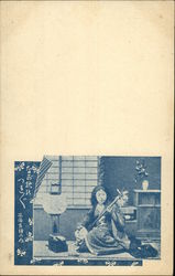 Photo of Woman Playing a Shamisen Postcard
