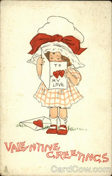 Young girl with big white hat reading a valentine card