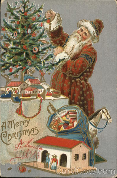 Santa decorating tree on table Santa Claus