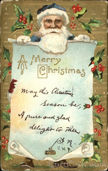 Santa in blue suit and hat holding a Christmas message
