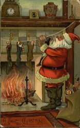 Santa Putting Presents in Stockings Santa Claus Postcard Postcard