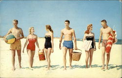 A group setting up for a day at the beach Postcard