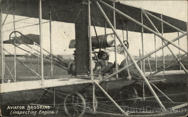 Aviator Brookins - Inspecting Engine of Biplane Aviators