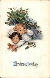 Two children in Bed with Vase of Holly on Table Postcard