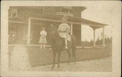 Girl on Horse In Front of House Girl on Horse In Front of House