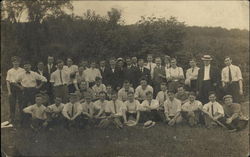 Group of men sitting and standing Group of men sitting and standing