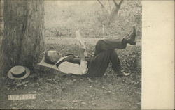 Man laying under a tree reading, Aug. 1911 Binghamton, NY Men Postcard Postcard