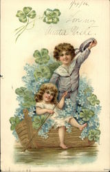 Little Boy and Girl in Gold Boat Surrounded by Forget-Me-Nots and Four-Leaf Clover Children Postcard Postcard