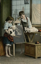 Boy and Girl Drawing Cats on Chalkboard Postcard