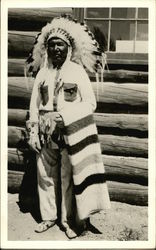 Native American in Headdress, Holding Striped Blanket Native Americana Postcard Postcard
