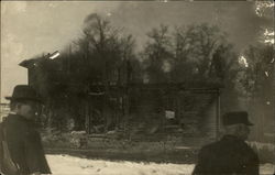 Men looking at ruins of burnt building Men looking at ruins of burnt building