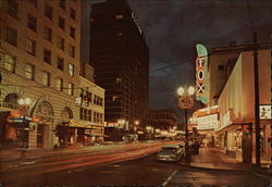 Glittering Portland by Night, S.W. Broadway, with the Famous Hilton Hotel at Left Postcard