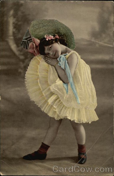 Little Girl With Yellow Dress and Wide-Brimmed Green Hat