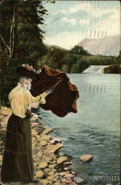 Woman in Brown Skirt and Yellow Blouse Opens Umbrella on the Shoreline