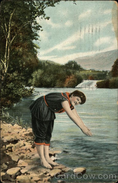 Woman in Black Bathing Suit Trimmed in Red Getting Ready to Dive into the Water