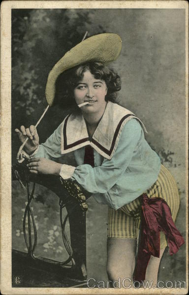 Woman in Yellow Striped Shorts and Blue Sailor Shirt Smoking Cigarette