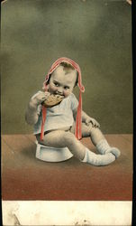 Little Boy Eating While Sitting on Potty Little Boy Eating While Sitting on Potty