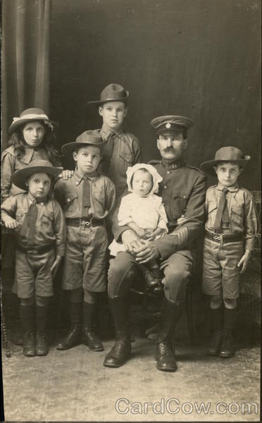 Family portrait father with children Boy Scouts