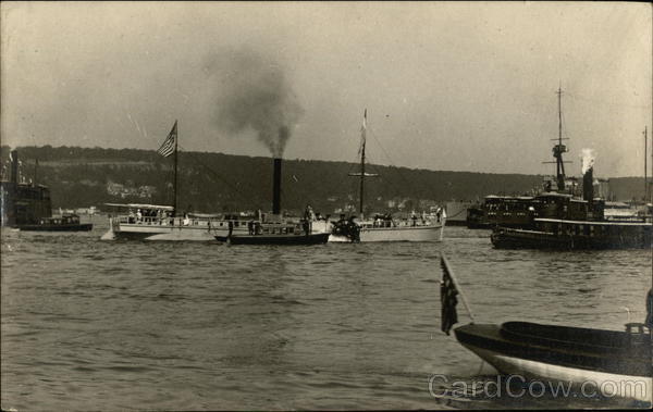 A fleet of ships, including a paddlewheeler and tugboats