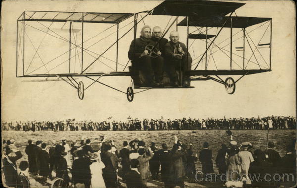 Early Airplane with Three Men Inside Aircraft