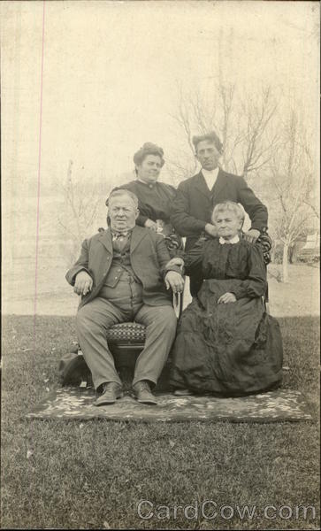 Family of Four Posing on Lawn with Rug 1909 Massilon Ohio
