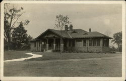 Photograph of a brick house in the early 20th century Postcard