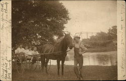 A horse-drawn carriage in the early 20th century. Postcard