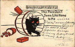 Black Cat in a Barrel Hiding from Thrown Objects Postcard
