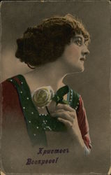 Lady holding a rose. Postcard