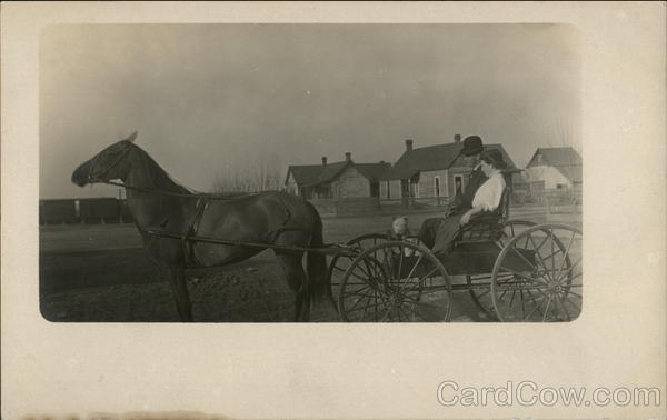 Couple and Dog in Horse Pulled Wagon Spokane Washington
