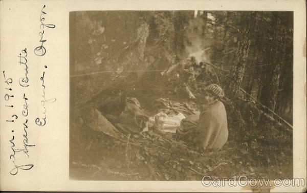 Woman sitting by Campfire in Woods Eugene Oregon