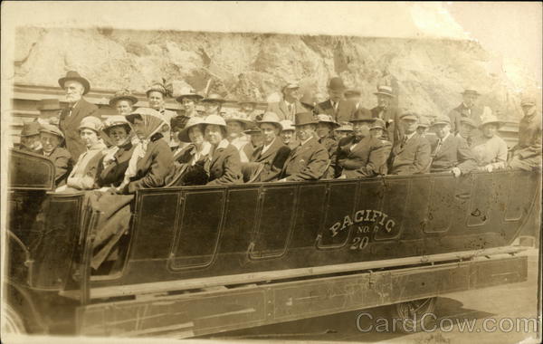 Group of people in an early tour bus Pacific No. 20 California