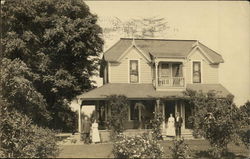 Two Couples in Front of a House Postcard