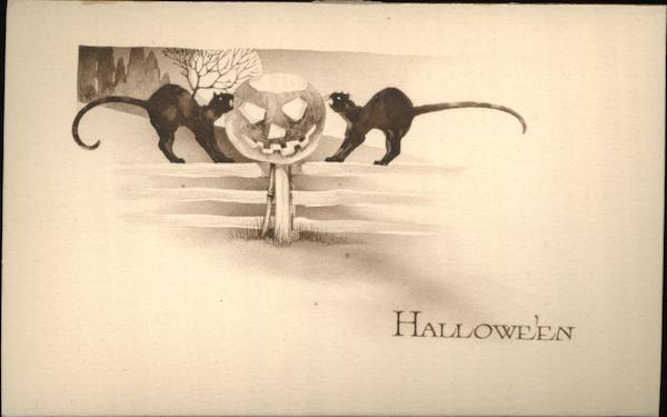 Two Black Cats on Fence With Jack O'Lantern Halloween