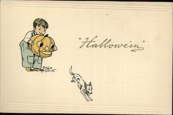 Boy Scaring Dog with Jack O'Lantern Halloween
