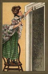 Woman Hanging Horseshoe Over Door Halloween Postcard Postcard Postcard
